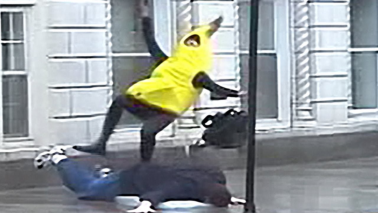 Image of man slipping over man in banana costume